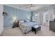 Serene main bedroom with a custom blue accent wall and ample natural light at 2322 Watchtower Ln, Charleston, SC 29414