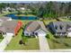 Charming single-story home with well-manicured lawn, mature trees, and a tranquil pond view at 240 Gazania Way, Charleston, SC 29414