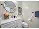 Modern bathroom featuring updated fixtures and a decorative mirror at 240 Gazania Way, Charleston, SC 29414