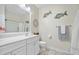 Well-lit bathroom with white cabinets, a mirror, and neutral decor at 240 Gazania Way, Charleston, SC 29414