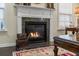 Elegant fireplace with granite surround and a decorative mantel at 240 Gazania Way, Charleston, SC 29414