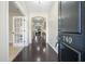 Inviting foyer with dark wood floors leading to the living spaces at 240 Gazania Way, Charleston, SC 29414
