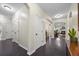 Spacious hallway with arched doorways and hardwood flooring at 240 Gazania Way, Charleston, SC 29414
