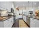 Galley kitchen featuring granite counters, stainless steel appliances, and ample cabinet space at 240 Gazania Way, Charleston, SC 29414