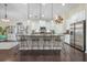 Kitchen featuring a large island with bar seating, stainless steel appliances and pendant lighting at 240 Gazania Way, Charleston, SC 29414