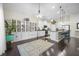 Bright, open kitchen featuring white cabinets, a breakfast bar, and modern appliances at 240 Gazania Way, Charleston, SC 29414
