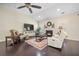 Bright living room features a fireplace, ceiling fan and hardwood floors at 240 Gazania Way, Charleston, SC 29414