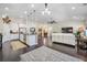 Bright open-concept living room with kitchen, dining, and stylish furnishings at 240 Gazania Way, Charleston, SC 29414