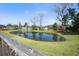 Scenic view of a pond surrounded by lush greenery and trees at 240 Gazania Way, Charleston, SC 29414
