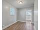 Neutral bedroom with wood grain floors, bright window, and closet doorway to adjoining space at 2673 Olympia Ave, North Charleston, SC 29405