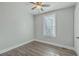 Bright bedroom features a ceiling fan, wood flooring, and a window for natural light at 2673 Olympia Ave, North Charleston, SC 29405