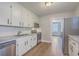 Bright kitchen with granite countertops, stainless steel appliances, and wood flooring at 2673 Olympia Ave, North Charleston, SC 29405