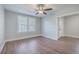 Living room featuring wood flooring, a neutral color scheme and two bright windows at 2673 Olympia Ave, North Charleston, SC 29405