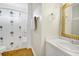 Bathroom featuring a wicker mirror, neutral walls, decorative shower curtain and hardwood floors at 2710 Laroche St, Edisto Beach, SC 29438