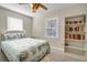 Bedroom featuring a queen bed, ceiling fan, and a bookshelf at 2710 Laroche St, Edisto Beach, SC 29438