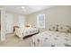 Bright bedroom with two twin beds featuring palm tree pattern bedding and ample natural light at 2710 Laroche St, Edisto Beach, SC 29438