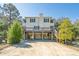 Charming two-story beach house with an elevated design and a spacious driveway at 2710 Laroche St, Edisto Beach, SC 29438