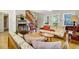 Cozy living room with neutral tones, wood flooring, plenty of windows, and stairs to the second floor at 2710 Laroche St, Edisto Beach, SC 29438
