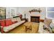 Charming living area featuring a decorative fireplace, cozy seating, and a warm, inviting ambiance at 2710 Laroche St, Edisto Beach, SC 29438