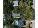 Aerial view of a neighborhood showcasing lush landscaping and a community pool, near the main road at 2863 Jasper Blvd, Sullivans Island, SC 29482