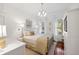 Bright bedroom with a metal bed frame, hardwood floors, and natural light at 2863 Jasper Blvd, Sullivans Island, SC 29482