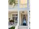 Inviting entrance with a charming sign, glass-paneled door, and decorative flower boxes at 2863 Jasper Blvd, Sullivans Island, SC 29482