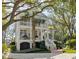 Stunning two-story home with a garage, inviting stairways, balconies, and landscaped surroundings at 2863 Jasper Blvd, Sullivans Island, SC 29482