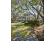 Beautiful home with a lush, landscaped front yard, mature trees and stone walkway at 2863 Jasper Blvd, Sullivans Island, SC 29482