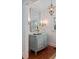Elegant hallway with an ornate mirror, sconces, decorative wallpaper, and hardwood floors at 2863 Jasper Blvd, Sullivans Island, SC 29482