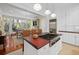 Bright kitchen boasts stainless steel appliances, wood countertops, island with cooktop, and charming pendant lighting at 2863 Jasper Blvd, Sullivans Island, SC 29482
