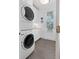 Well-equipped laundry room with stacked washer and dryer, sink, and ample counter space at 2863 Jasper Blvd, Sullivans Island, SC 29482