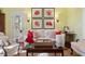 Inviting living room with coral artwork, floral sofa, and cozy armchairs at 2863 Jasper Blvd, Sullivans Island, SC 29482