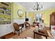 Living room features built-in bookcases, fireplace, hardwood floors, and natural light at 2863 Jasper Blvd, Sullivans Island, SC 29482