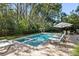 Refreshing pool with a brick patio, sun loungers, and beautifully landscaped surroundings at 2863 Jasper Blvd, Sullivans Island, SC 29482