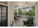 Comfortable porch features a porch swing, wicker chairs, and a serene outdoor atmosphere at 2863 Jasper Blvd, Sullivans Island, SC 29482