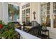 Cozy porch featuring wicker furniture, decorative plants, and a charming outdoor ambiance at 2863 Jasper Blvd, Sullivans Island, SC 29482