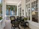 Inviting porch with wicker seating, ornamental decor, and a relaxing outdoor setting at 2863 Jasper Blvd, Sullivans Island, SC 29482