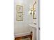 Elegant powder room with designer wallpaper, framed art, a decorative mirror, and a pedestal sink at 2863 Jasper Blvd, Sullivans Island, SC 29482