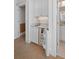 Convenient wet bar featuring a sink, mini-fridge, marble countertop, and storage at 2863 Jasper Blvd, Sullivans Island, SC 29482