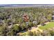 Aerial view of a home surrounded by trees in a community with a lush golf course at 2928 Baywood Dr, Seabrook Island, SC 29455