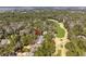 Beautiful aerial view of a home surrounded by lush trees adjacent to a manicured golf course at 2928 Baywood Dr, Seabrook Island, SC 29455
