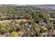 Beautiful aerial view of a two-story home surrounded by lush trees near a golf course at 2928 Baywood Dr, Seabrook Island, SC 29455
