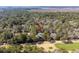 Aerial shot of home surrounded by trees, near a golf course, and close to marshland at 2928 Baywood Dr, Seabrook Island, SC 29455