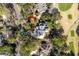 Aerial view of a modern home with an elongated driveway surrounded by lush trees and a golf course at 2928 Baywood Dr, Seabrook Island, SC 29455