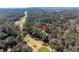 Aerial view of a home surrounded by lush trees in a community with a lush golf course at 2928 Baywood Dr, Seabrook Island, SC 29455