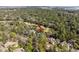 An aerial shot shows a home surrounded by trees located near a lush golf course at 2928 Baywood Dr, Seabrook Island, SC 29455