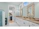 Well-lit bathroom featuring dual sinks, marble countertops, and modern fixtures at 2928 Baywood Dr, Seabrook Island, SC 29455