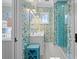 Stylish bathroom with colorful wallpaper, a white vanity with double sinks, and a glass shower stall at 2928 Baywood Dr, Seabrook Island, SC 29455