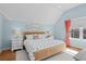 Bright bedroom with vaulted ceilings, light blue walls, and neutral decor at 2928 Baywood Dr, Seabrook Island, SC 29455