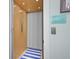 Residential elevator interior with wood paneled walls and blue striped rug at 2928 Baywood Dr, Seabrook Island, SC 29455